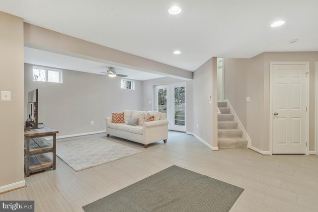 living room with recessed lighting, baseboards, and stairs