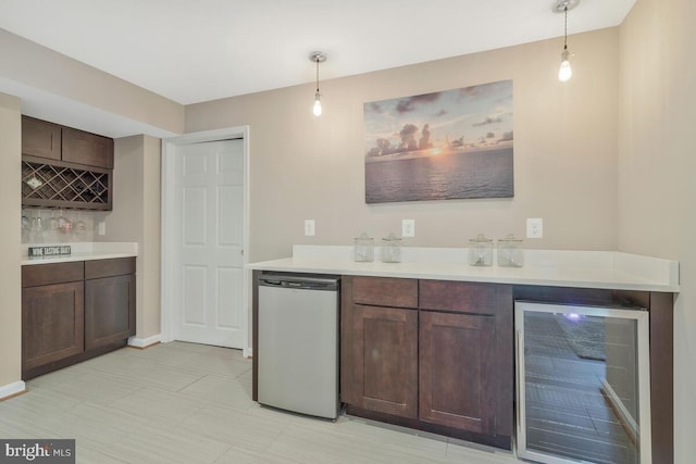 kitchen featuring wine cooler, light countertops, dishwasher, and decorative light fixtures