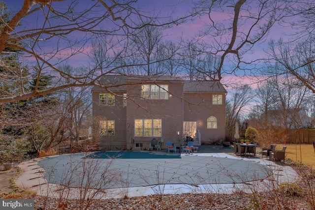 rear view of property with fence