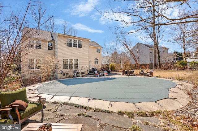 view of pool featuring a patio area, fence, and a fenced in pool