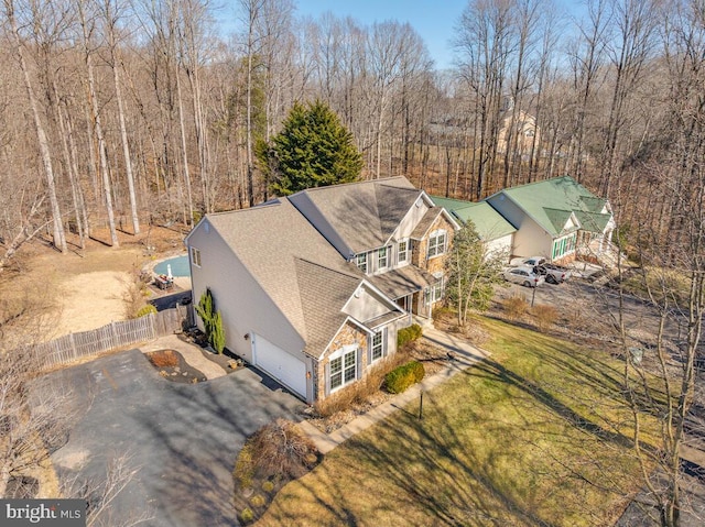 aerial view with a wooded view