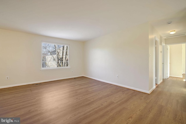 empty room with wood-type flooring