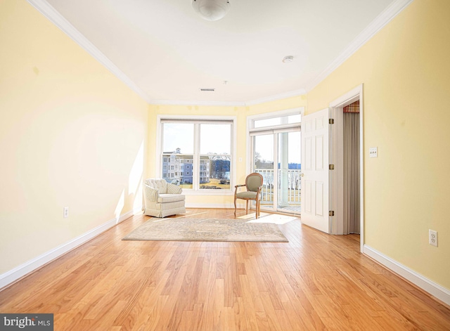 unfurnished room featuring light hardwood / wood-style flooring and ornamental molding