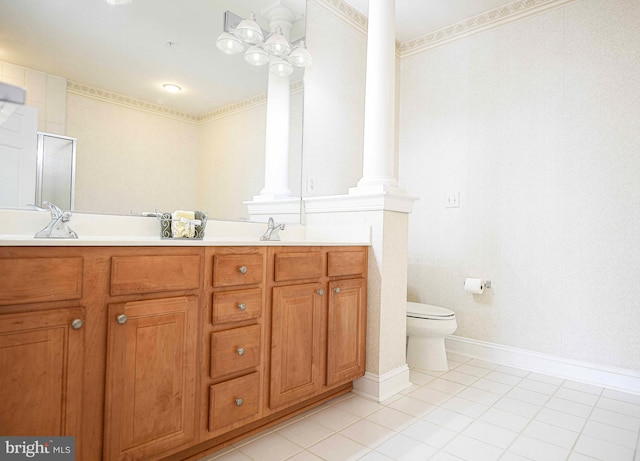 bathroom with ornate columns, vanity, tile patterned floors, and toilet