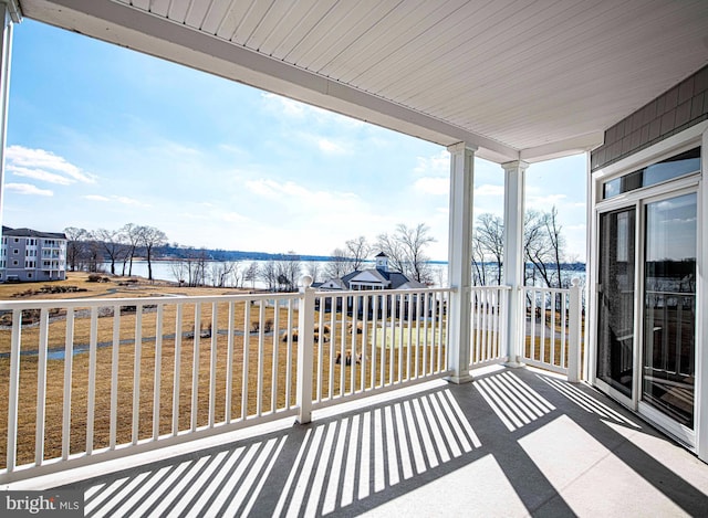 balcony featuring a water view