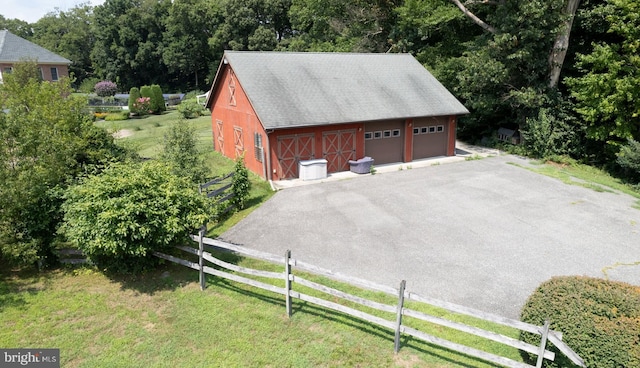 garage with a lawn