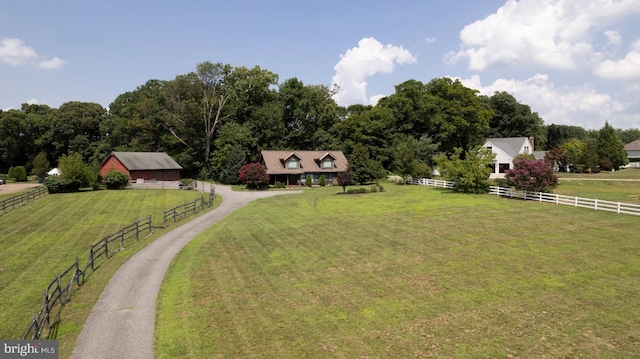 view of yard with a rural view