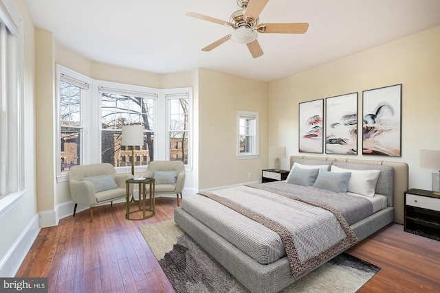 bedroom featuring dark wood-type flooring and ceiling fan