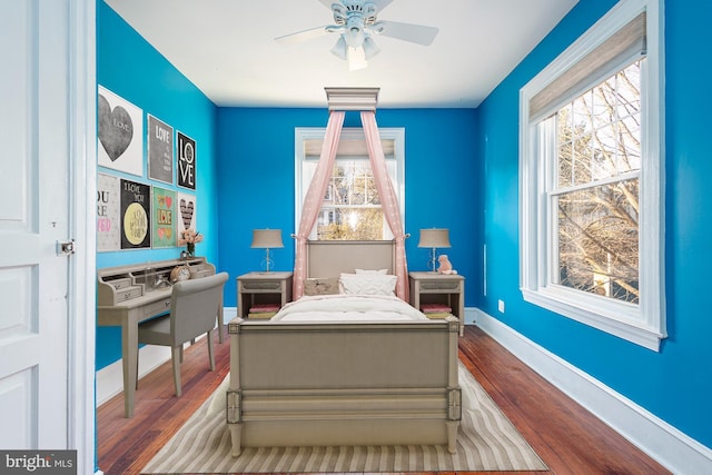 bedroom with wood-type flooring and ceiling fan