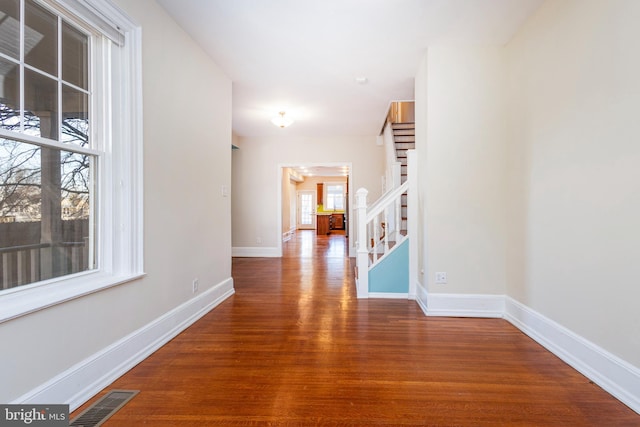 hallway with dark wood-type flooring