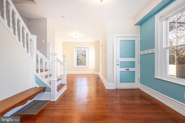 entrance foyer with dark hardwood / wood-style floors