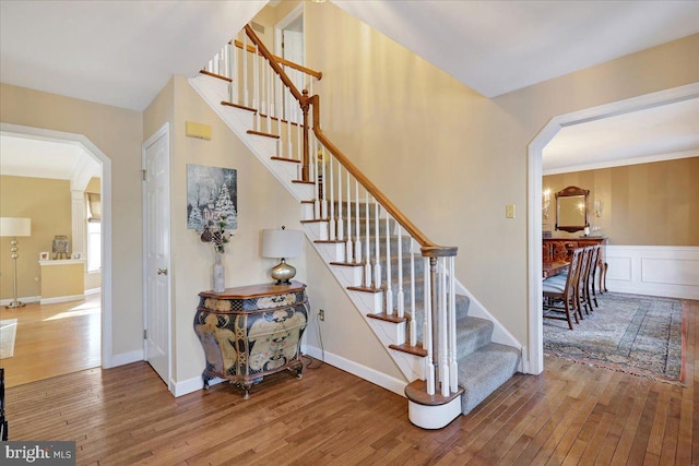 stairway featuring wood-type flooring