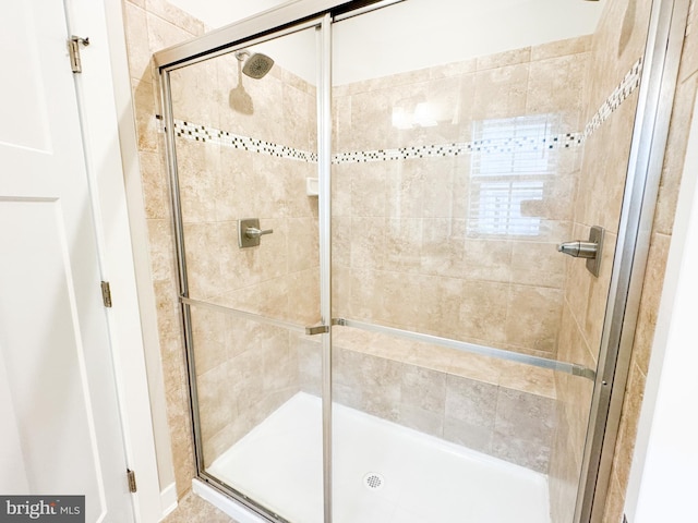 bathroom featuring an enclosed shower