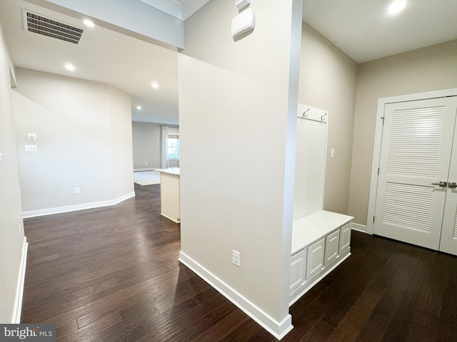 hall with dark hardwood / wood-style floors