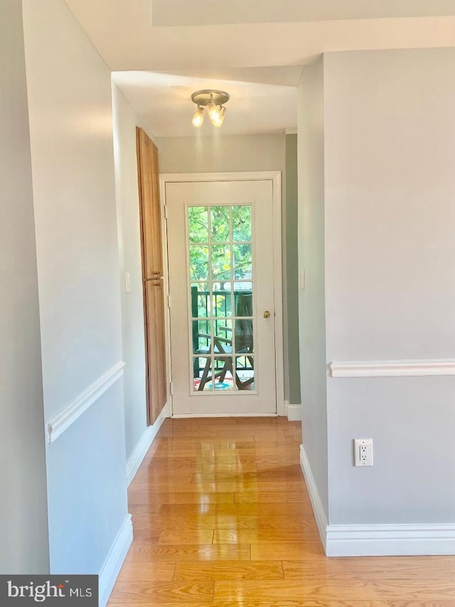 doorway to outside featuring light hardwood / wood-style flooring