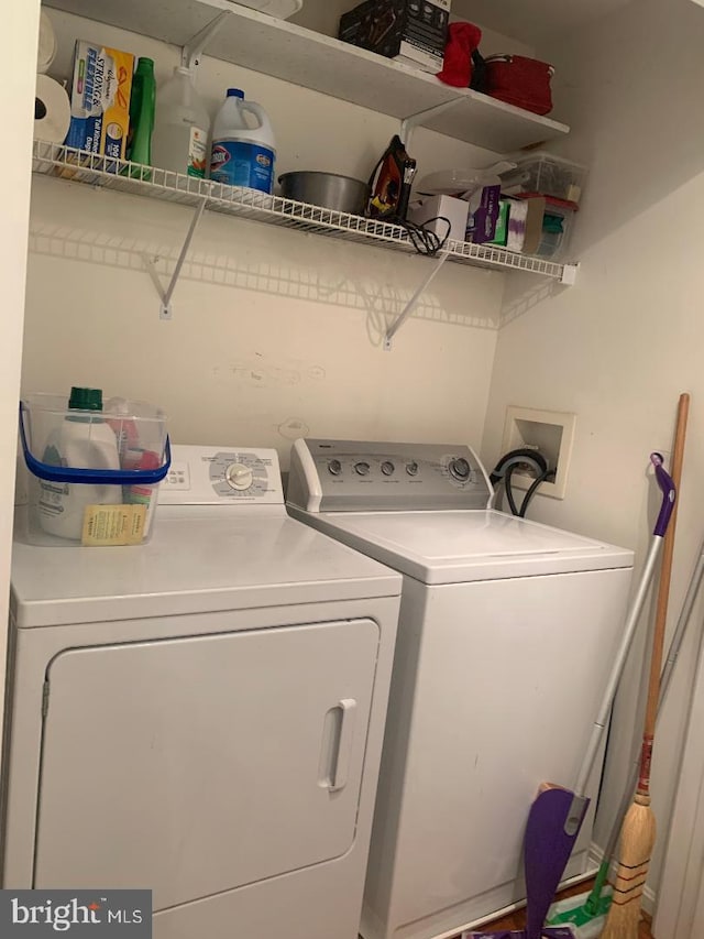 washroom featuring independent washer and dryer