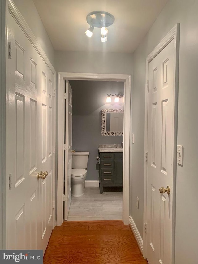 hallway featuring wood-type flooring