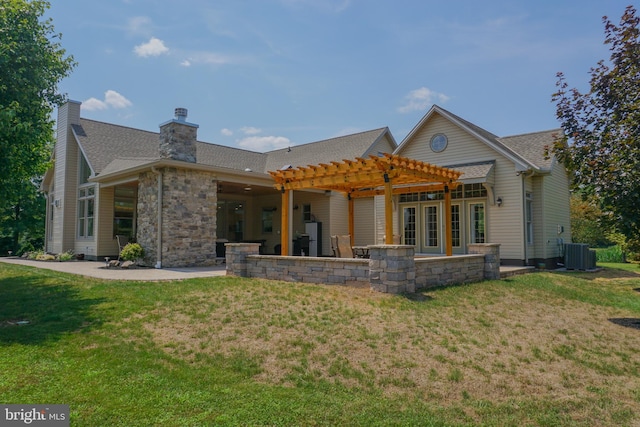 back of house with cooling unit, a yard, a pergola, and a patio