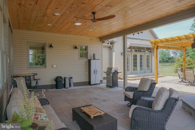 view of patio with a grill and ceiling fan