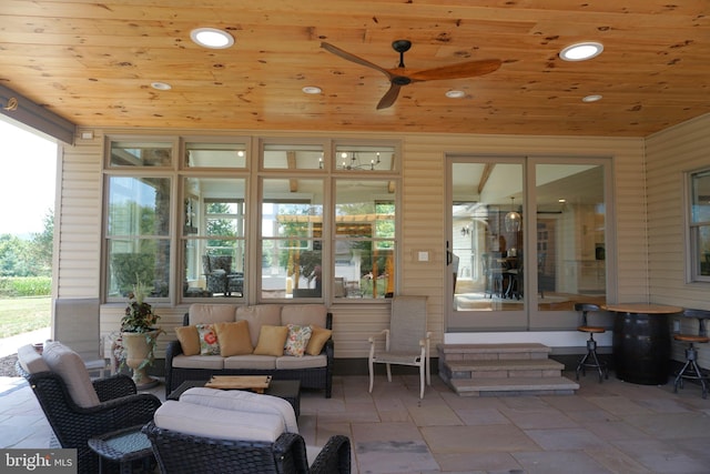 view of patio / terrace with an outdoor living space and ceiling fan