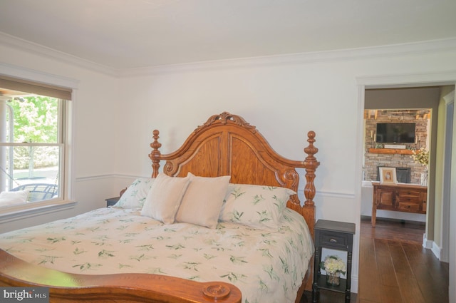 bedroom with dark wood-type flooring and ornamental molding