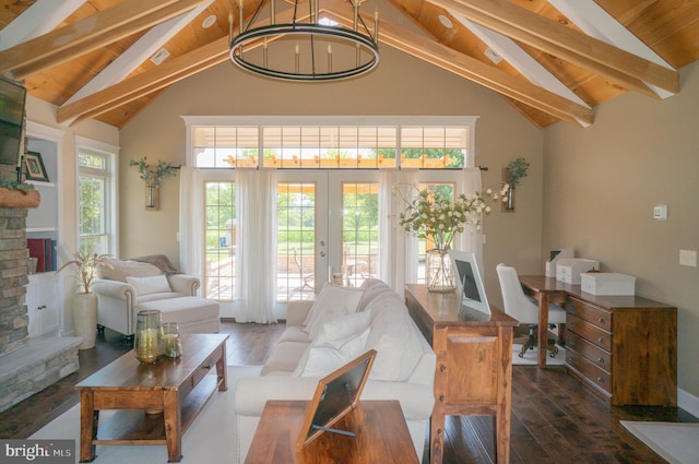 living room featuring dark hardwood / wood-style floors, an inviting chandelier, beam ceiling, and french doors