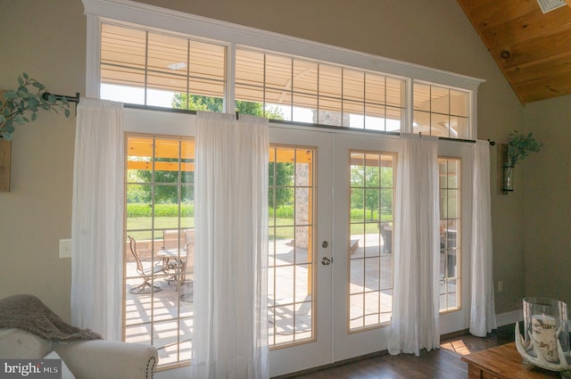 doorway with vaulted ceiling, hardwood / wood-style floors, wooden ceiling, and french doors