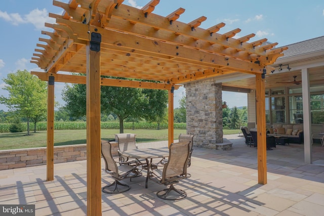 view of patio / terrace featuring ceiling fan, an outdoor hangout area, and a pergola