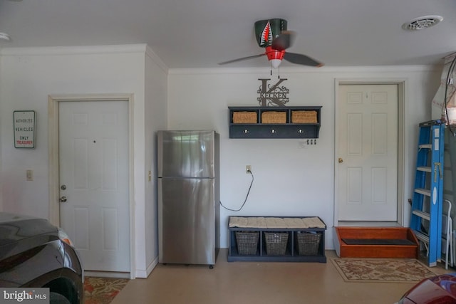 kitchen with ornamental molding, stainless steel refrigerator, and ceiling fan