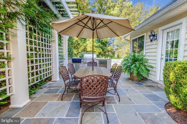 view of patio with area for grilling and grilling area