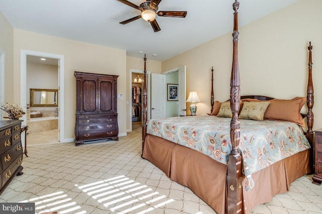 bedroom with light carpet, ceiling fan, and ensuite bathroom