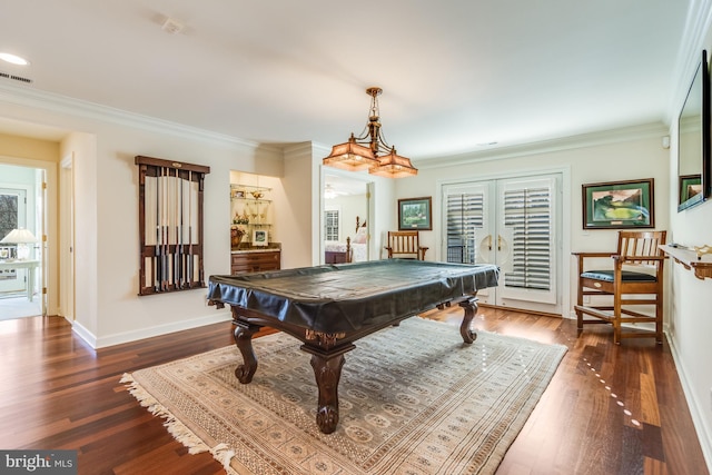 playroom featuring dark hardwood / wood-style flooring, crown molding, billiards, and french doors