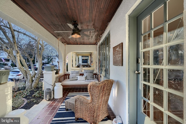 view of patio featuring ceiling fan and covered porch