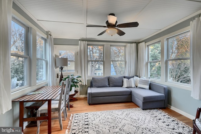 sunroom with plenty of natural light and ceiling fan