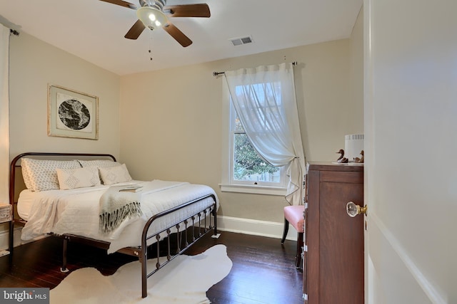 bedroom with dark wood-type flooring and ceiling fan