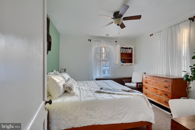 carpeted bedroom featuring ceiling fan