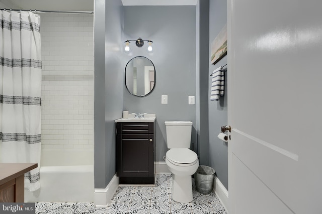 full bathroom featuring shower / tub combo with curtain, vanity, toilet, and tile patterned floors