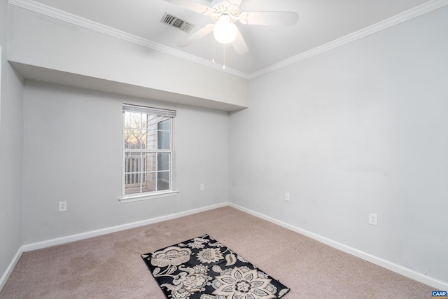 carpeted empty room featuring crown molding and ceiling fan