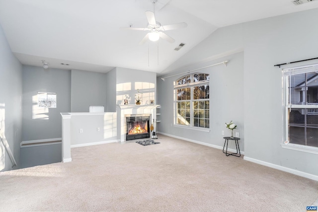 living room with ceiling fan, light colored carpet, and lofted ceiling