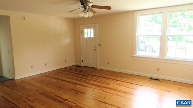 entryway featuring ceiling fan, a healthy amount of sunlight, and light hardwood / wood-style flooring