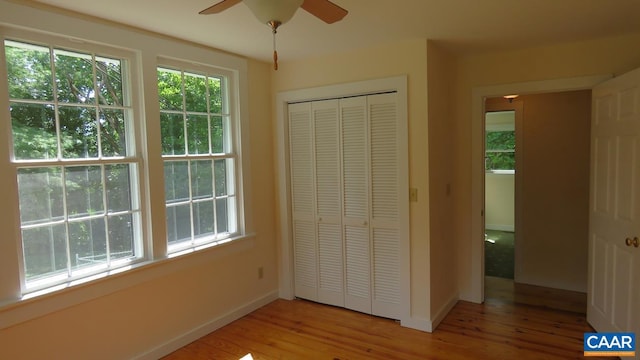 unfurnished bedroom featuring a closet and light wood-type flooring