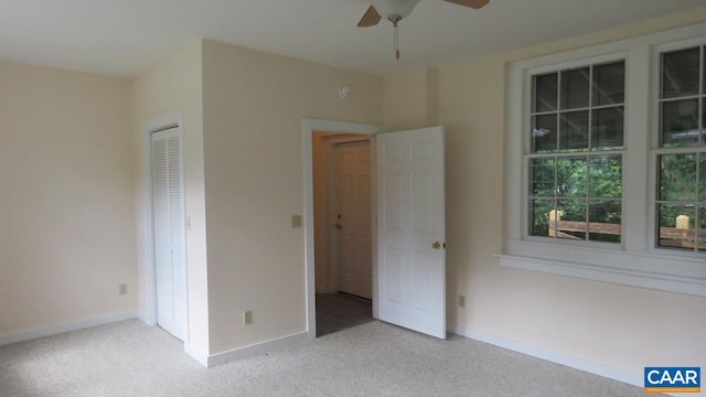 unfurnished bedroom featuring ceiling fan and light carpet