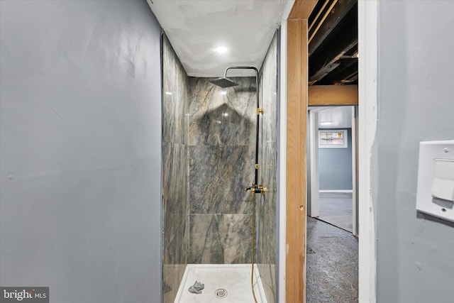 bathroom with a tile shower