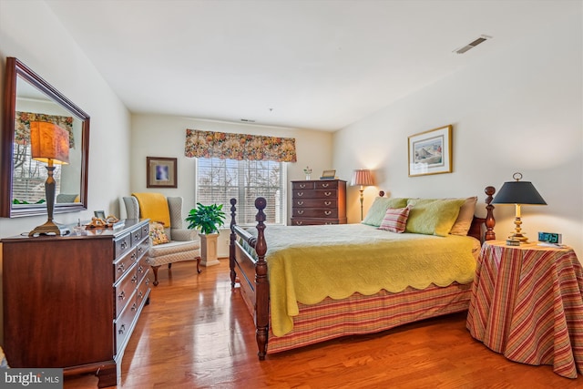 bedroom featuring wood-type flooring