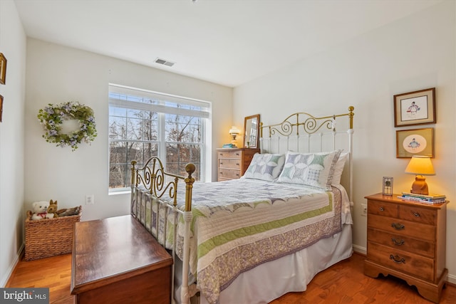 bedroom with wood-type flooring