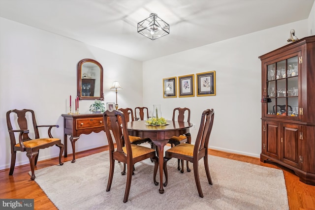 dining space featuring light wood-type flooring