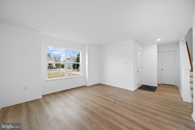 spare room featuring light hardwood / wood-style floors