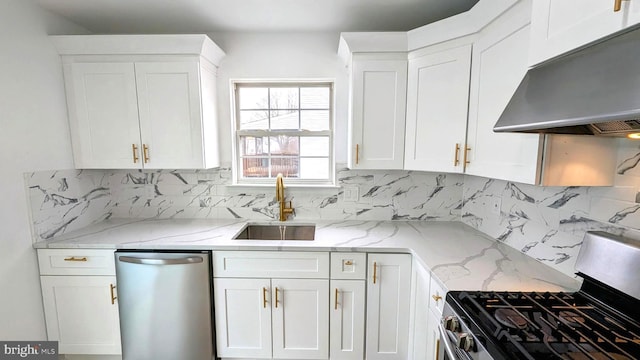 kitchen featuring sink, appliances with stainless steel finishes, white cabinetry, light stone counters, and exhaust hood