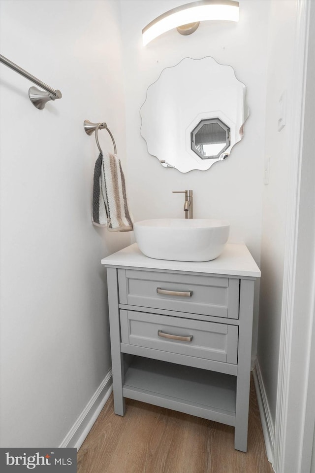 bathroom featuring vanity and hardwood / wood-style flooring