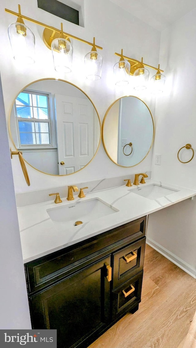 bathroom featuring vanity and hardwood / wood-style floors